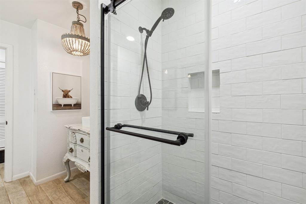 724 Edgehill Drive Hurst, TX 76053 - Photo 21 of 27 a bathroom with a shower