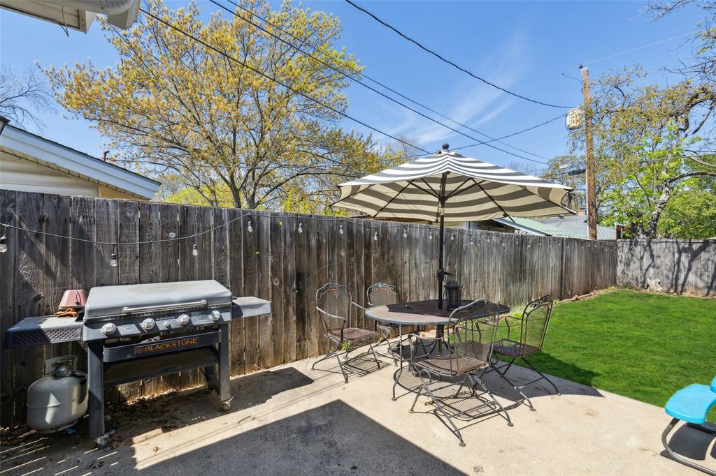 724 Edgehill Drive Hurst, TX 76053 - Photo 24 of 27 a view of a chairs and table in the patio