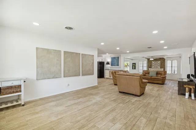 a view of kitchen with furniture and wooden floor