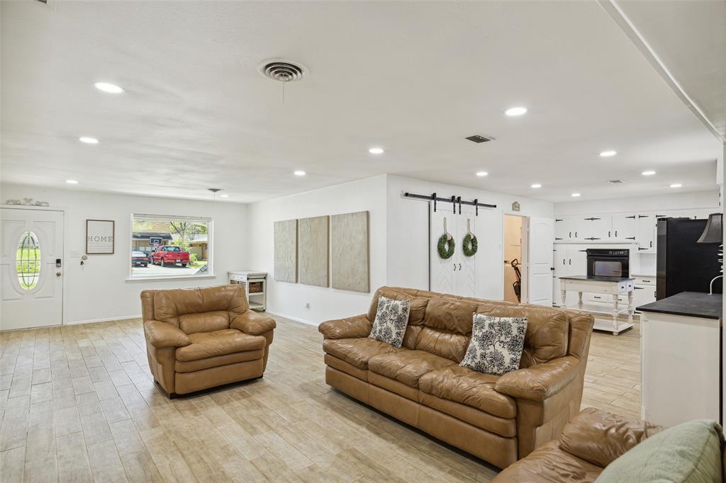 724 Edgehill Drive Hurst, TX 76053 - Photo 8 of 27 a living room with furniture and a couch