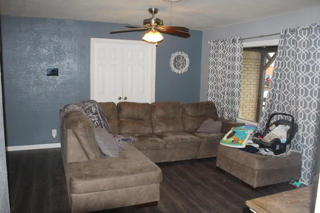 a living room with furniture and a window