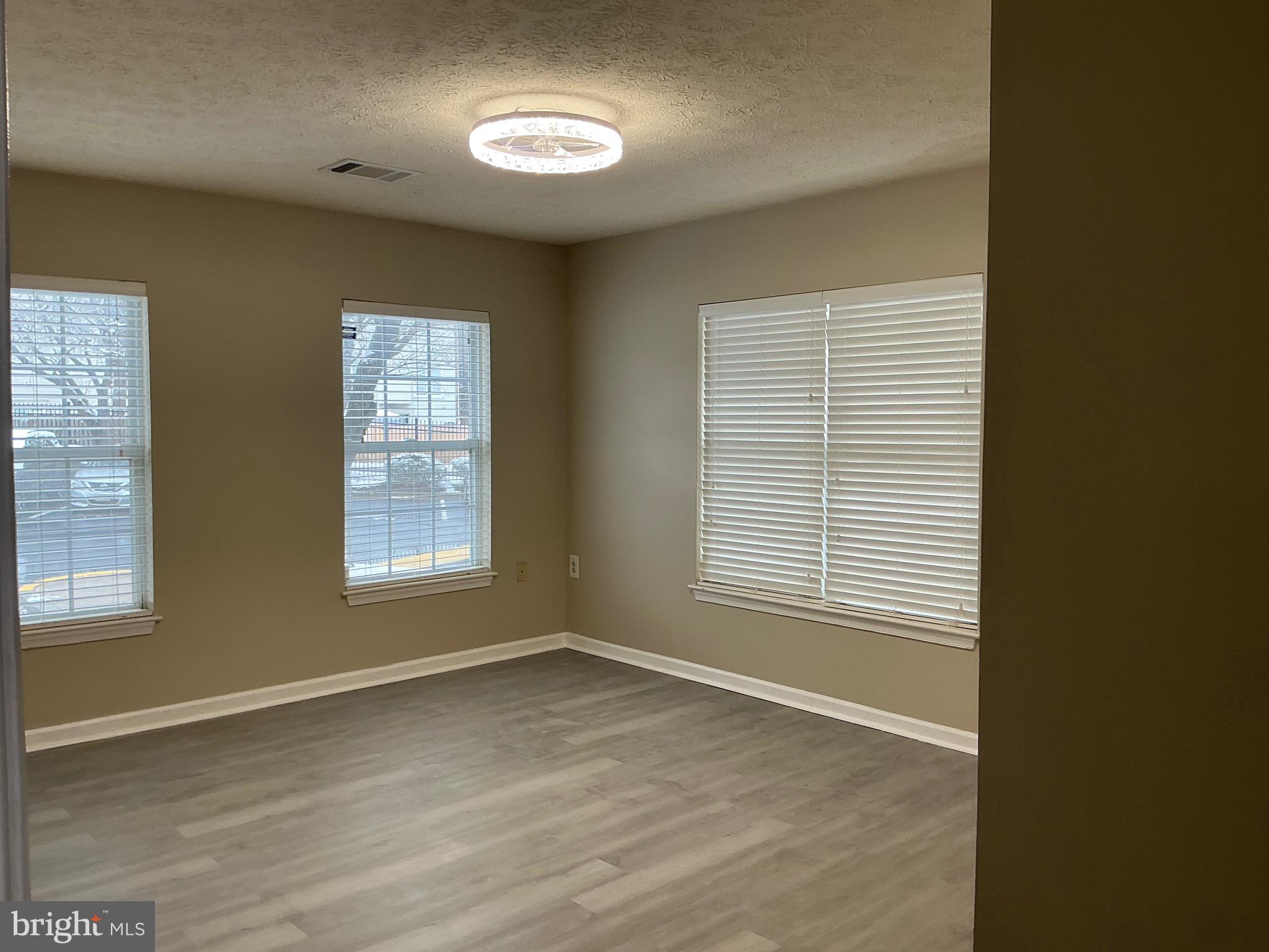8961 Town Center Circle, Unit 1101 Upper Marlboro, MD 20774 - Photo 9 of 10 an empty room with a window