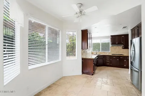 a large bedroom with a large bed and a window
