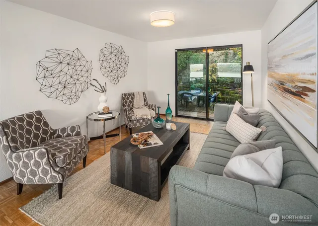a living room with furniture and a large window
