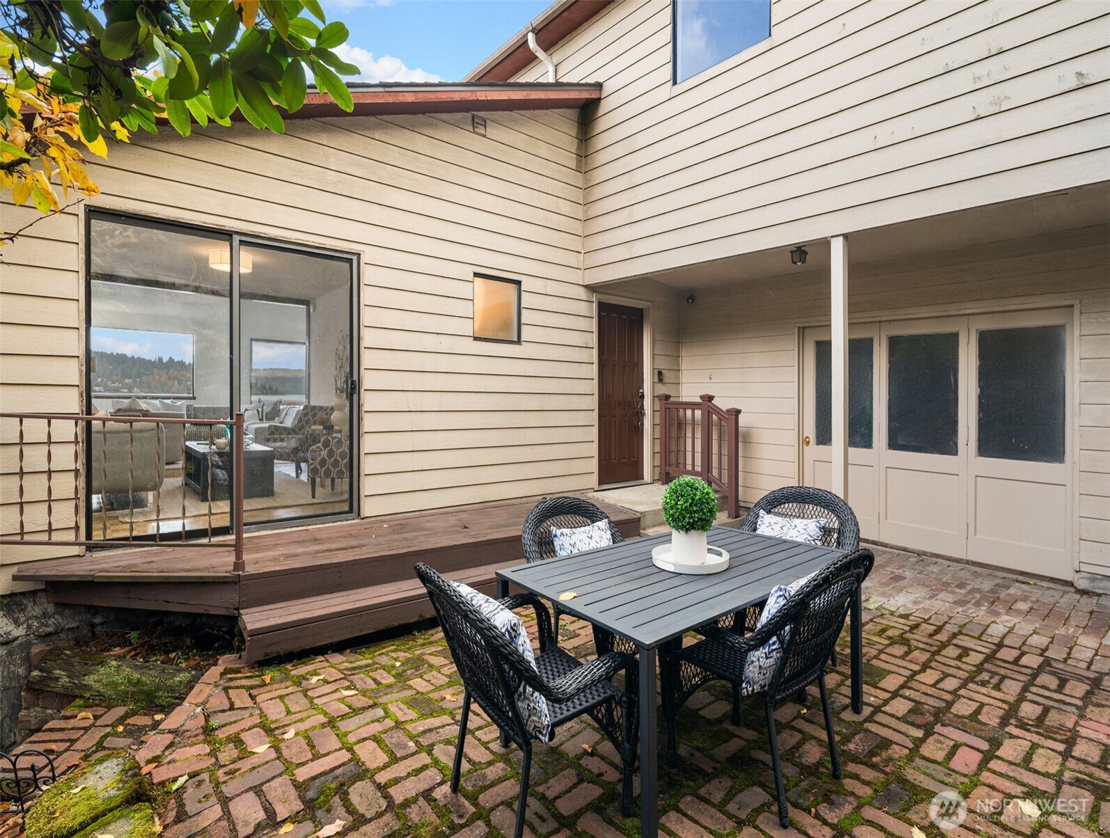 9764 Rainier Avenue South Seattle, WA 98118 - Photo 16 of 40 a backyard of a house with table and chairs