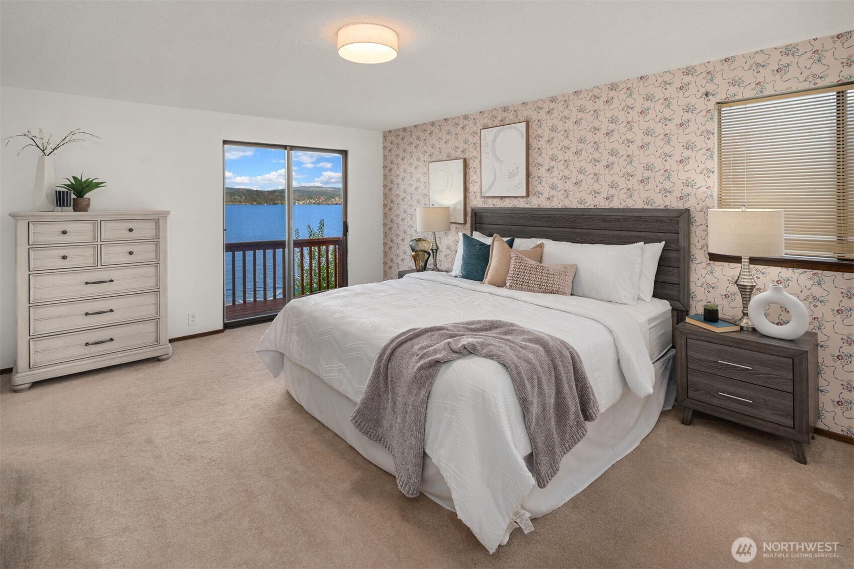 9764 Rainier Avenue South Seattle, WA 98118 - Photo 18 of 40 a spacious bedroom with a bed a dresser and next to a window
