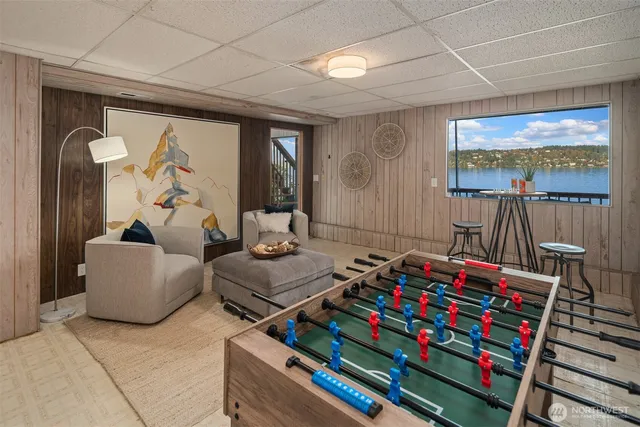 a room with furniture a flat screen tv and a window