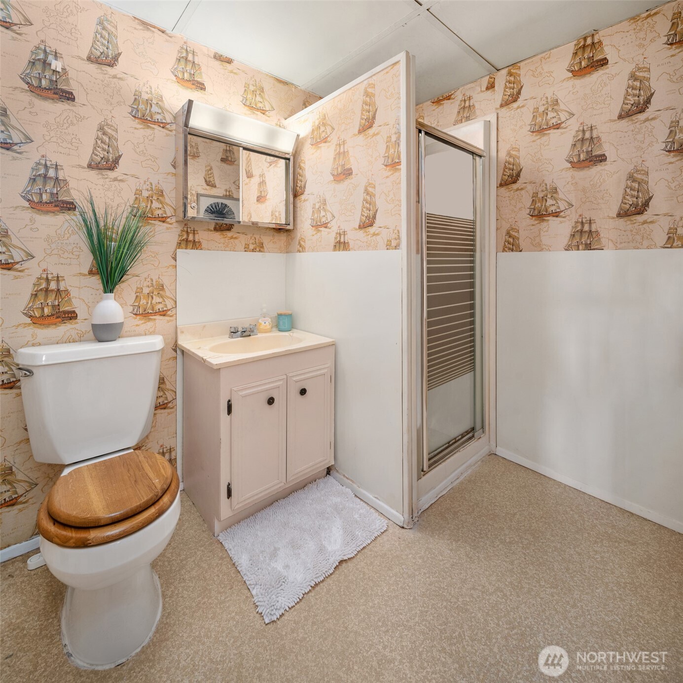 9764 Rainier Avenue South Seattle, WA 98118 - Photo 25 of 40 a bathroom with a toilet sink and shower