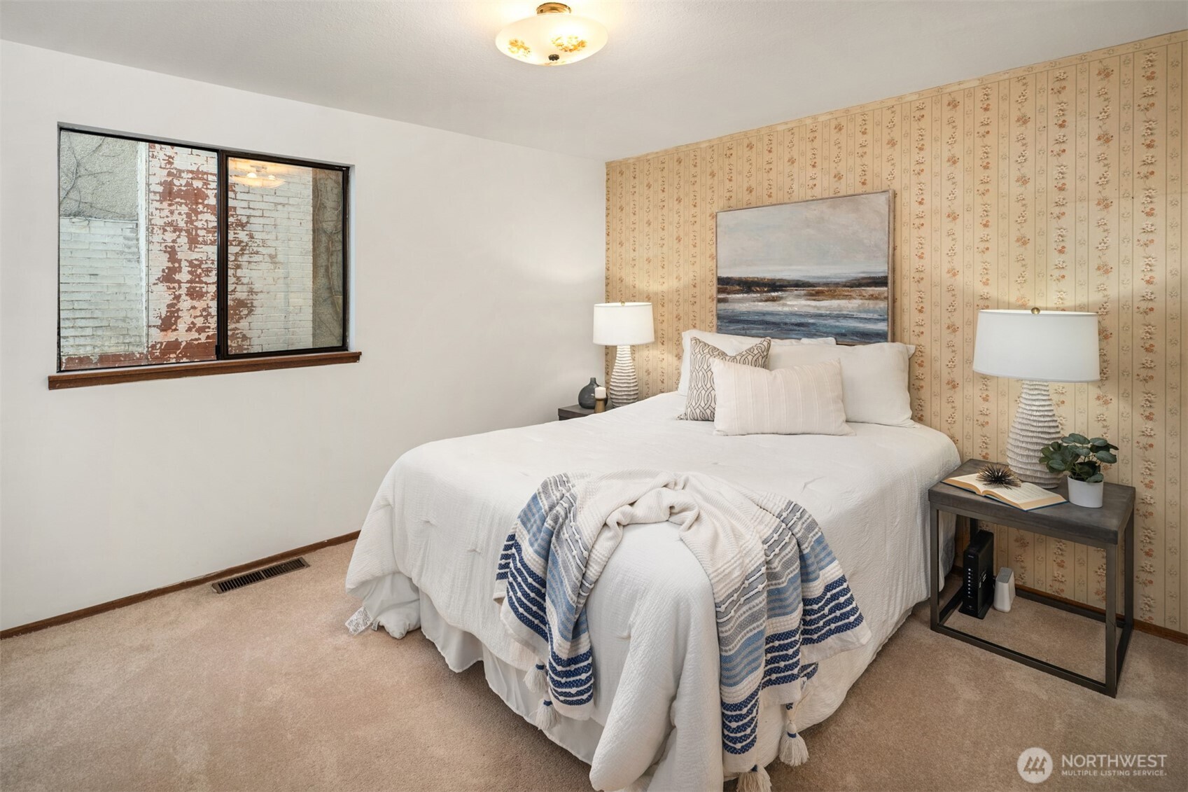 9764 Rainier Avenue South Seattle, WA 98118 - Photo 26 of 40 a bedroom with a bed and a painting on the wall