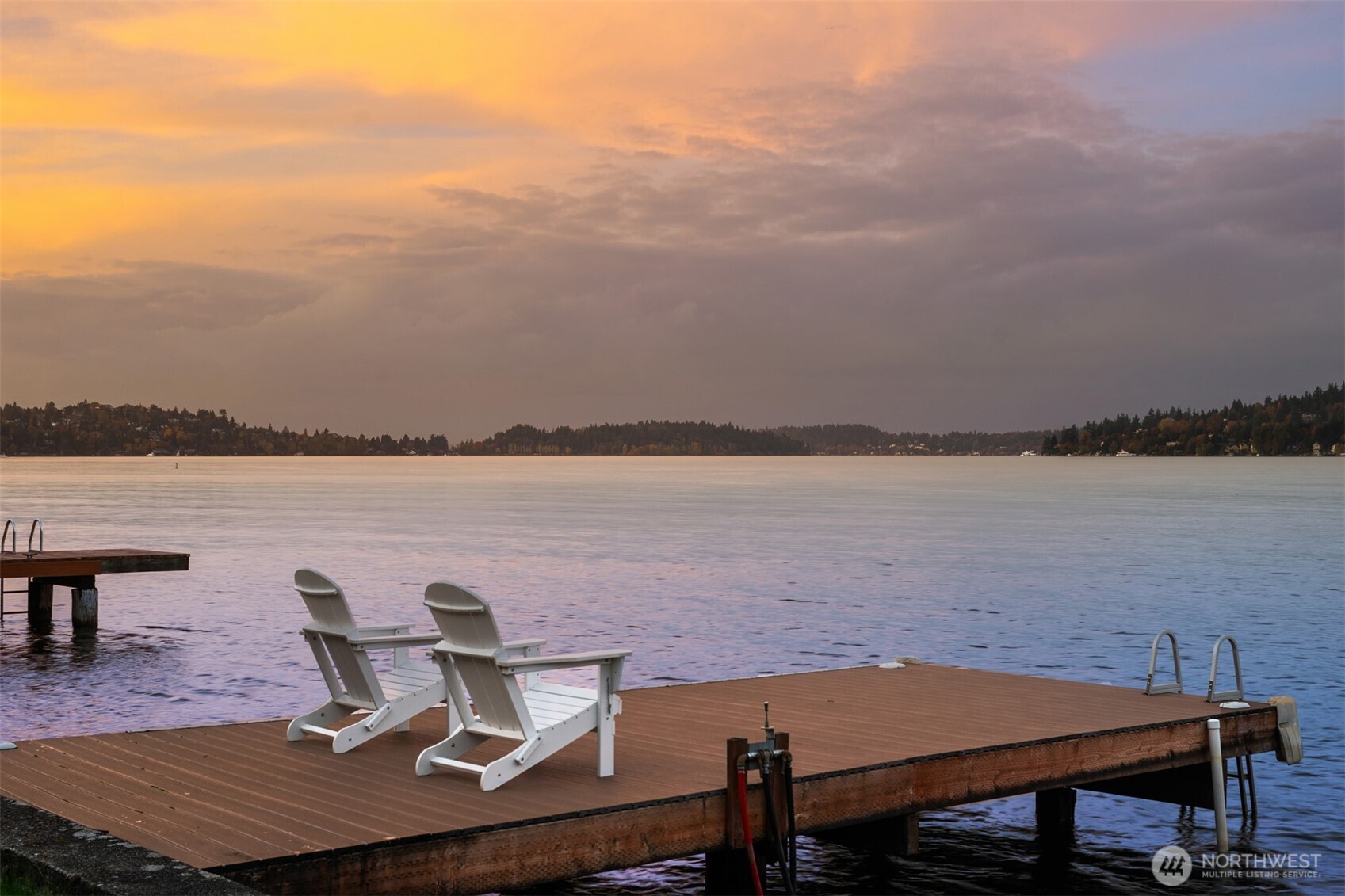 9764 Rainier Avenue South Seattle, WA 98118 - Photo 3 of 40 a view of a lake with table and chairs