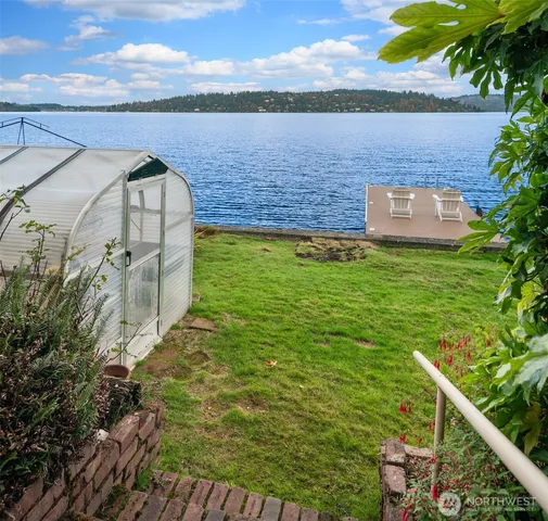 a view of a lake with a building in the background