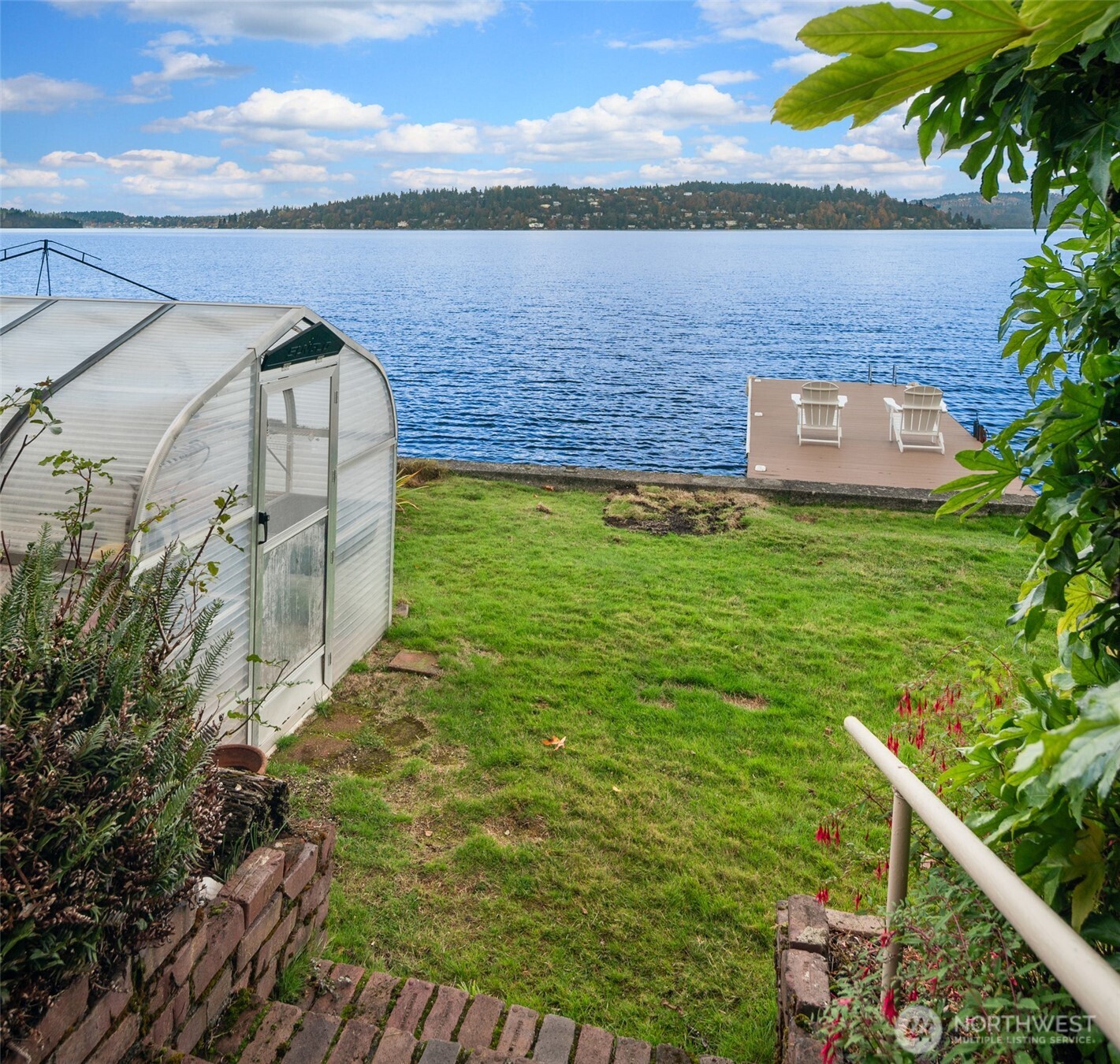 9764 Rainier Avenue South Seattle, WA 98118 - Photo 34 of 40 a view of a lake with a building in the background