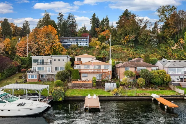 an aerial view of a house with lake view