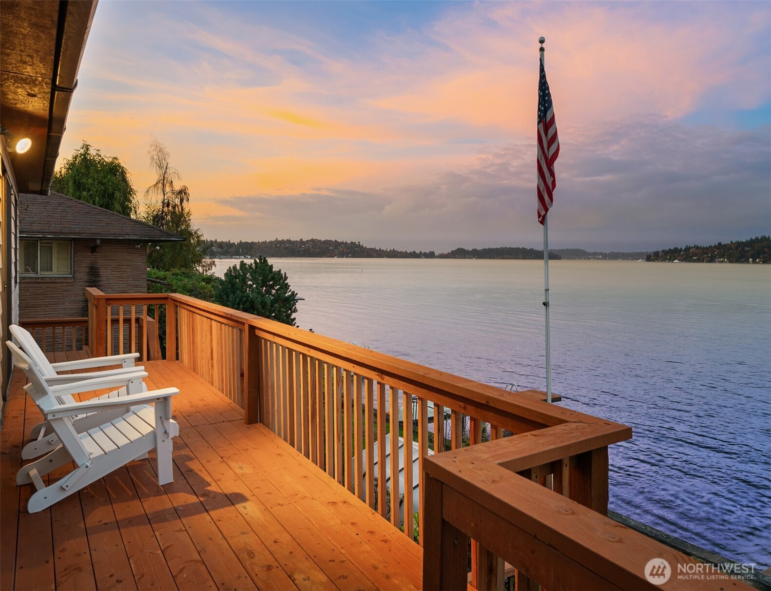 9764 Rainier Avenue South Seattle, WA 98118 - Photo 4 of 40 a view of a roof deck with two chair and wooden floor