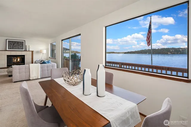 a living room with furniture and a floor to ceiling window