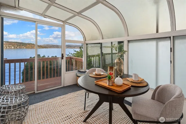 a view of a dining room with furniture window and outside view