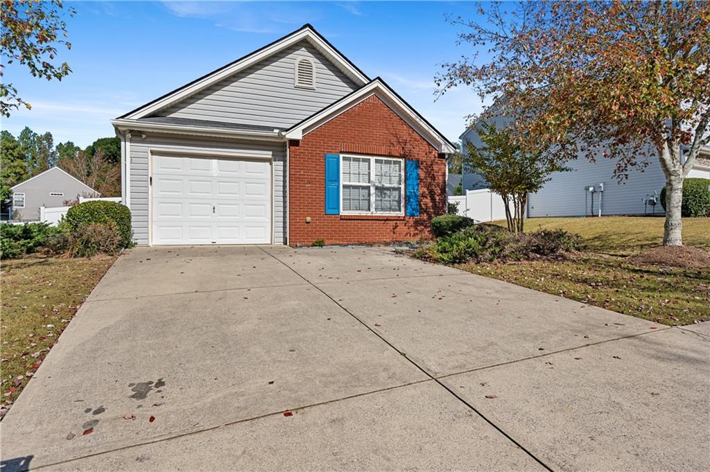 232 Silver Ridge Drive Dallas, GA 30157 - Photo 1 of 1 a front view of a house with a yard and garage