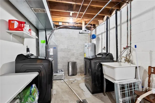 a kitchen with a stove a sink and a refrigerator