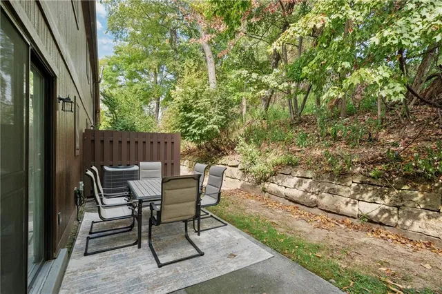 a view of a chairs and table in the balcony