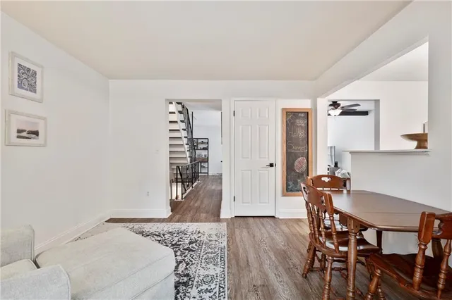 a bedroom with furniture and wooden floor
