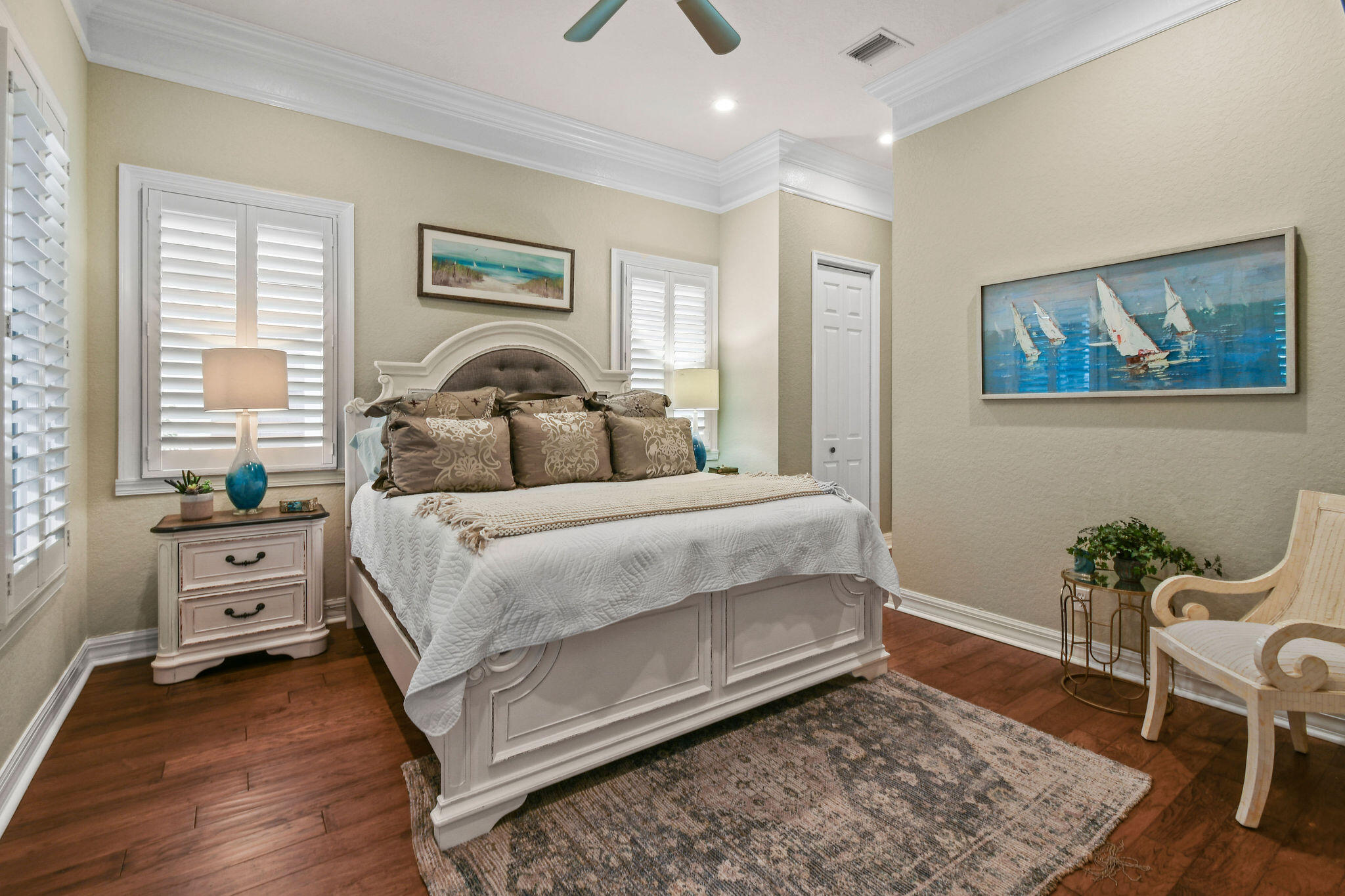 167 Arklow Avenue Jupiter, FL 33458 - Photo 18 of 60 a bedroom with a bed and wooden floor
