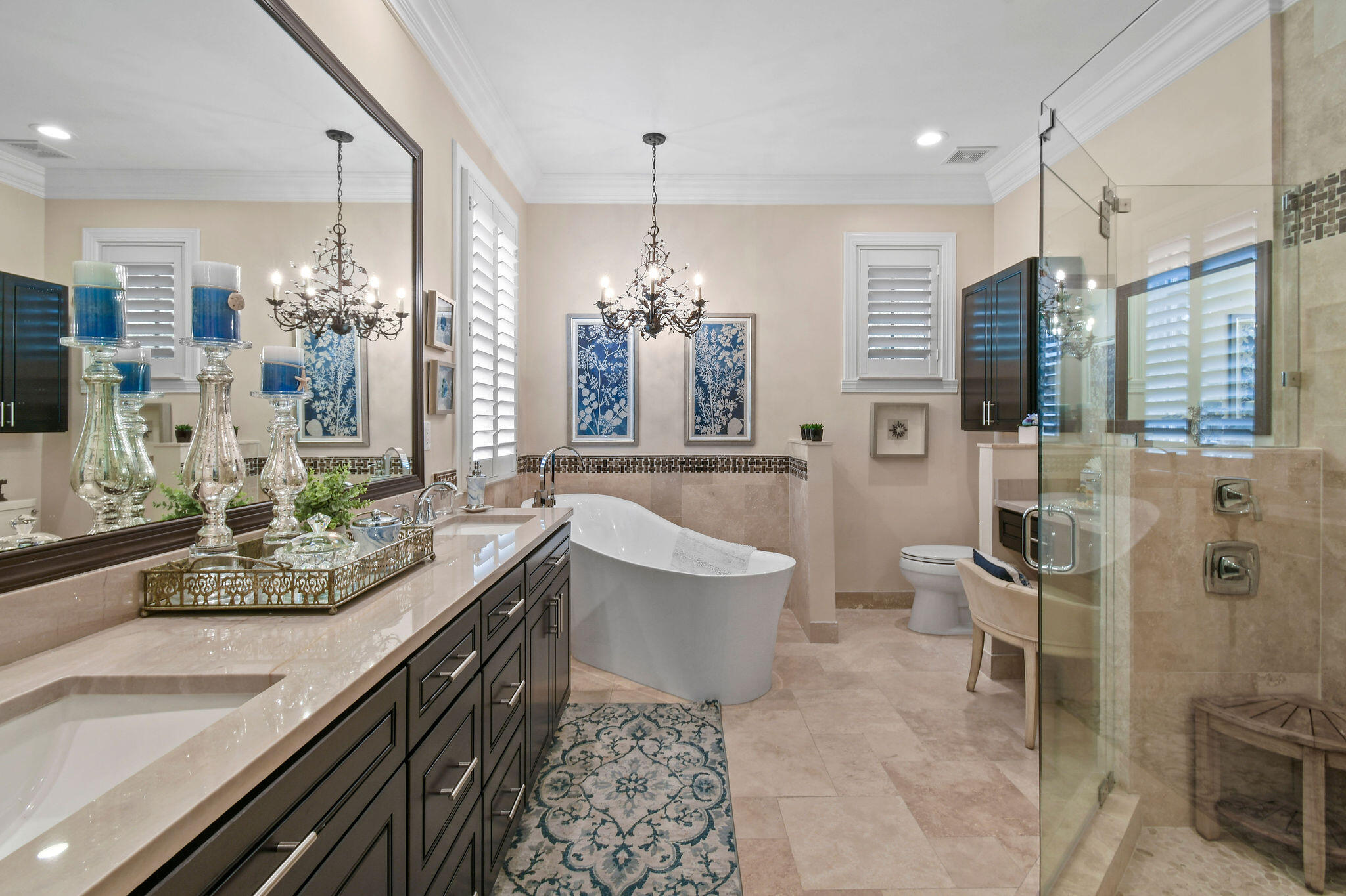 167 Arklow Avenue Jupiter, FL 33458 - Photo 22 of 60 a spacious bathroom with a double vanity sink a large mirror and a shower