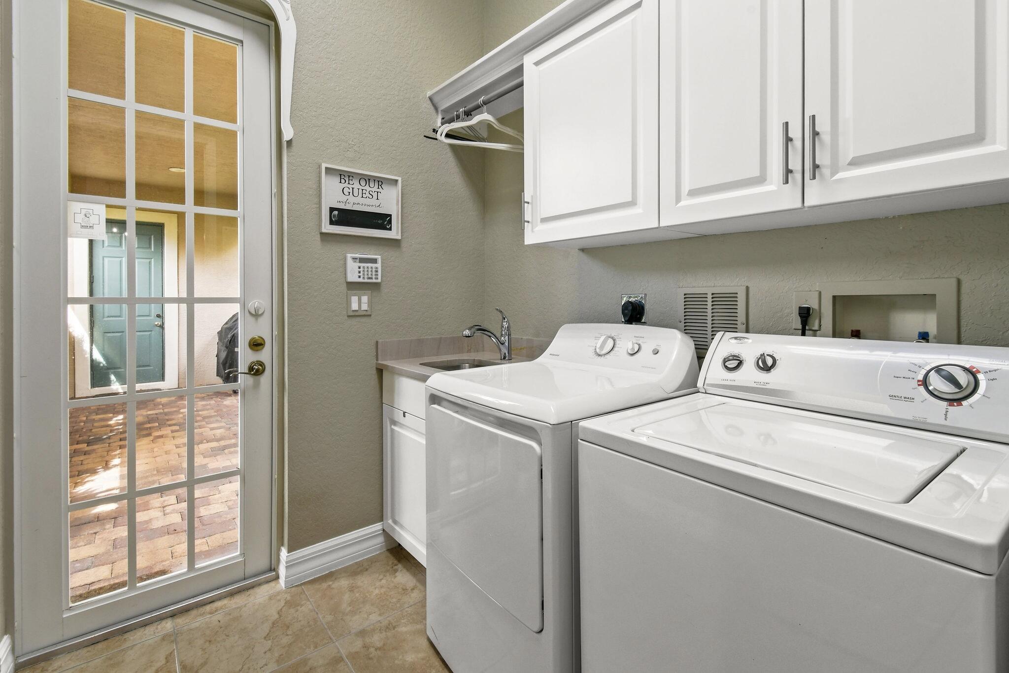167 Arklow Avenue Jupiter, FL 33458 - Photo 36 of 60 a utility room with dryer and washer