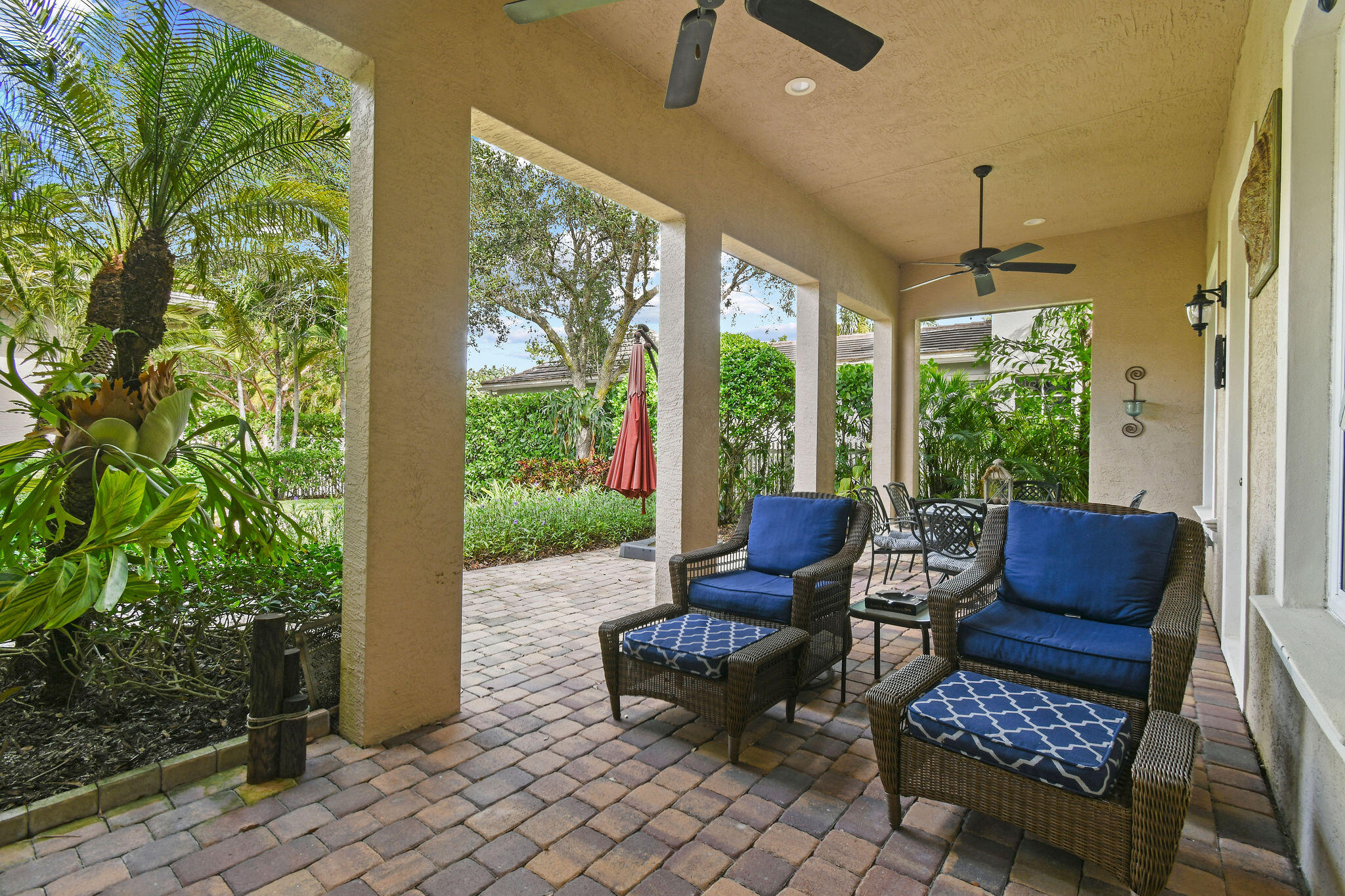 167 Arklow Avenue Jupiter, FL 33458 - Photo 40 of 60 a outdoor living space with furniture and garden view