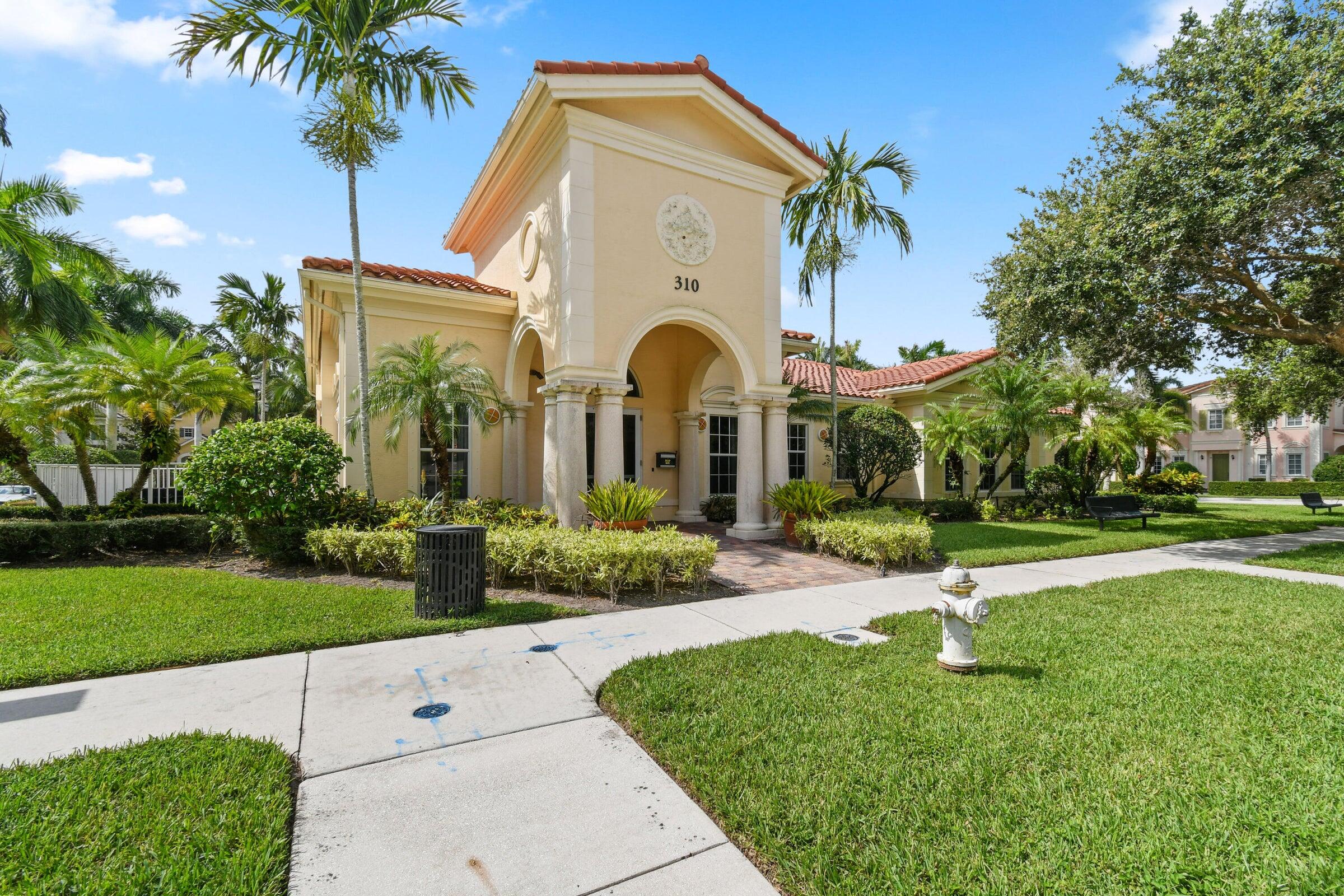 167 Arklow Avenue Jupiter, FL 33458 - Photo 51 of 60 a front view of a house with garden