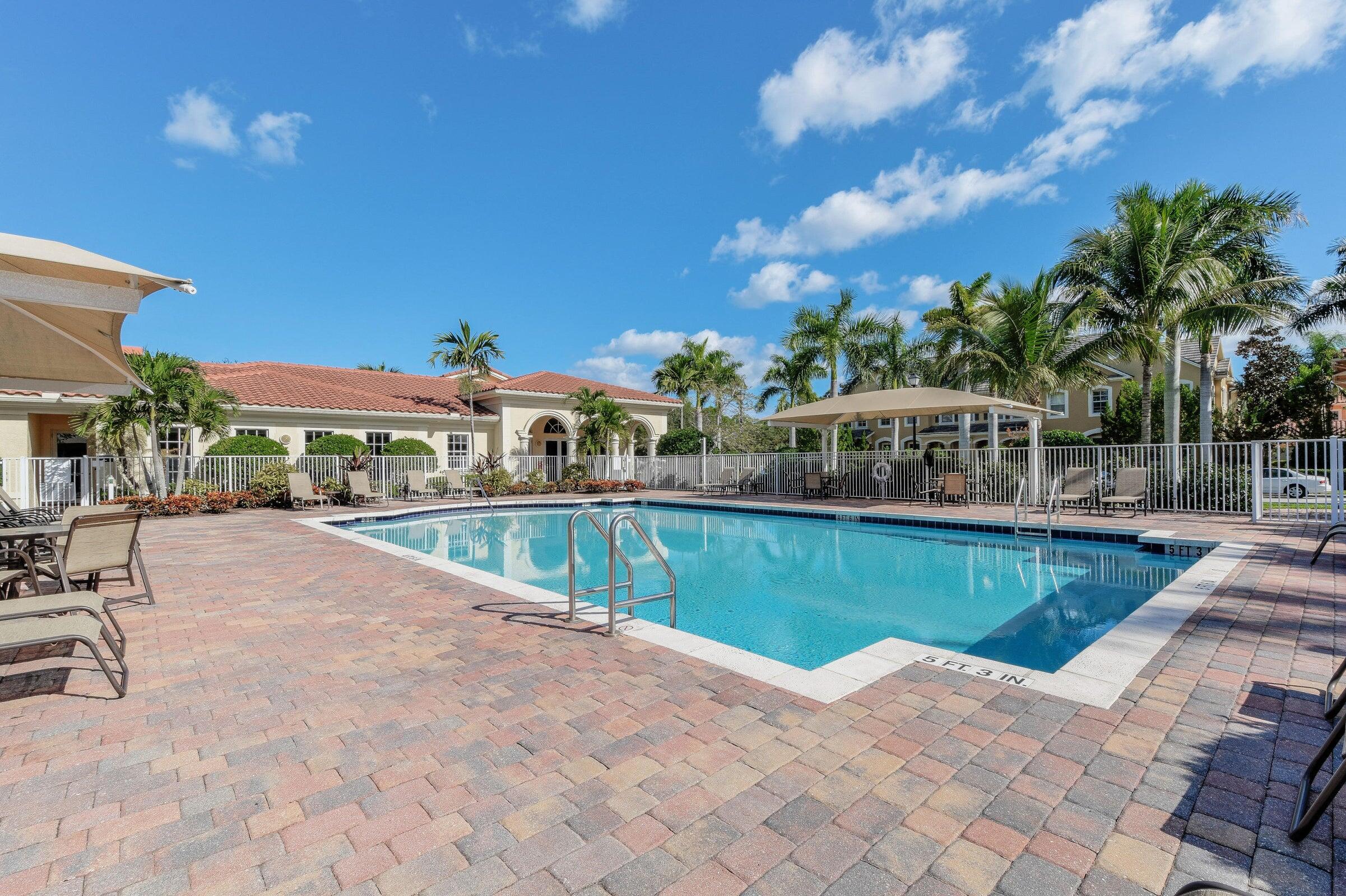 167 Arklow Avenue Jupiter, FL 33458 - Photo 53 of 60 a view of a swimming pool with a patio