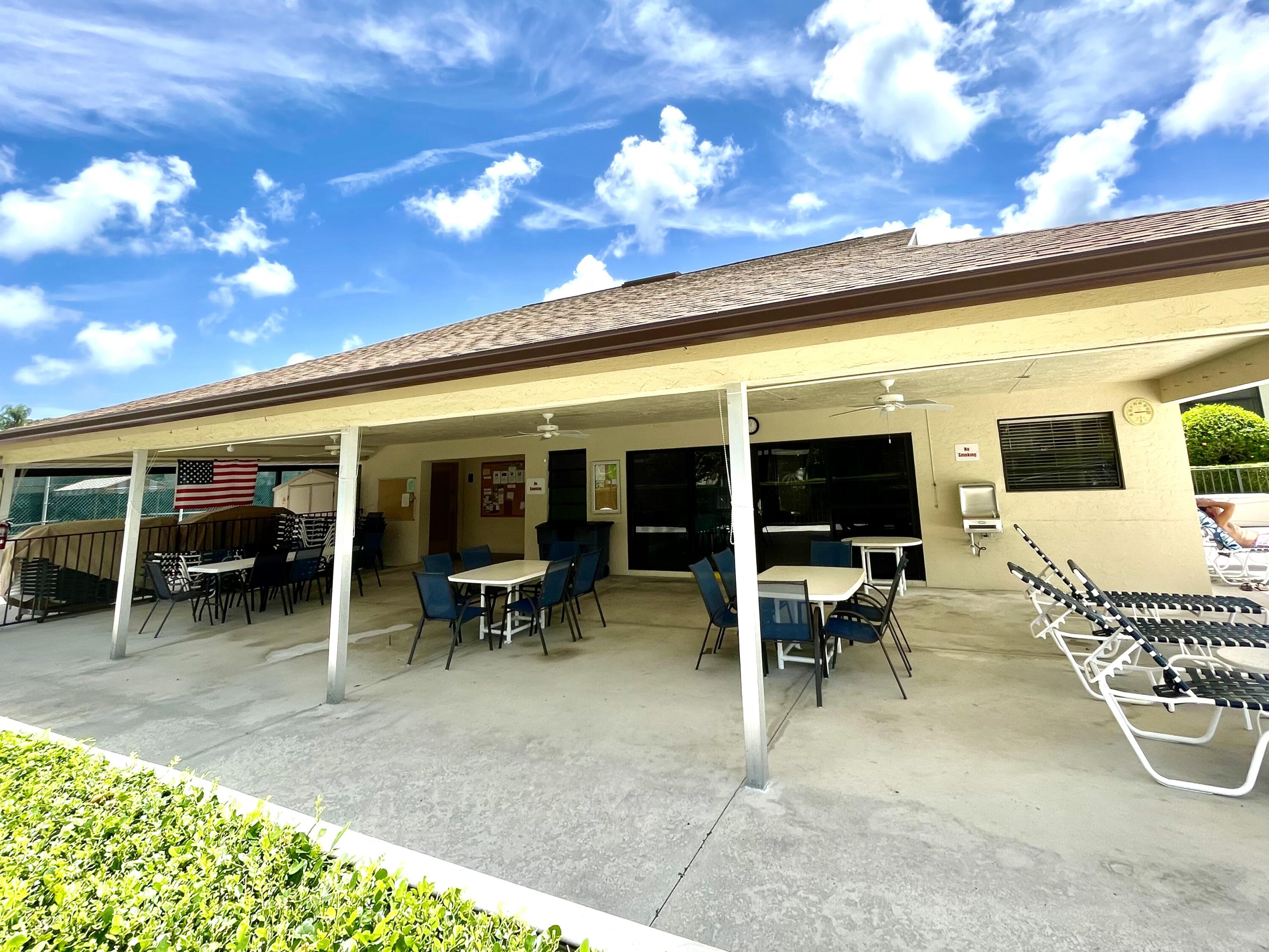 1501 Pinecrest Circle, Unit E Jupiter, FL 33458 - Photo 22 of 25 Covered seating plus bicycle storage