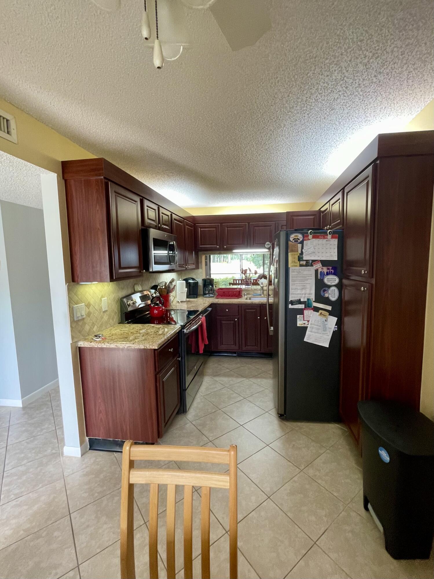 1501 Pinecrest Circle, Unit E Jupiter, FL 33458 - Photo 7 of 25 Updated kitchen and appliances