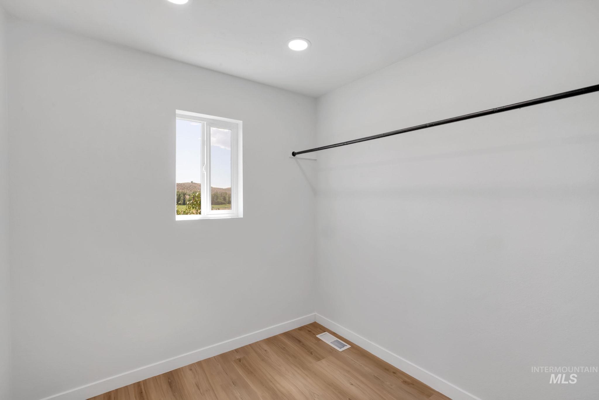 1070 West Indian Valley Road Indian Valley, ID 83632 - Photo 26 of 50 Walk in closet with light wood finished floors