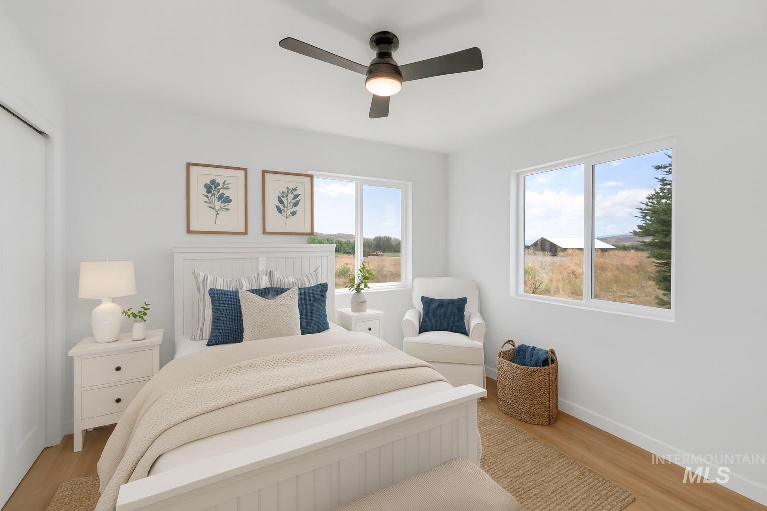1070 West Indian Valley Road Indian Valley, ID 83632 - Photo 29 of 50 Bedroom with light wood-style flooring and ceiling fan