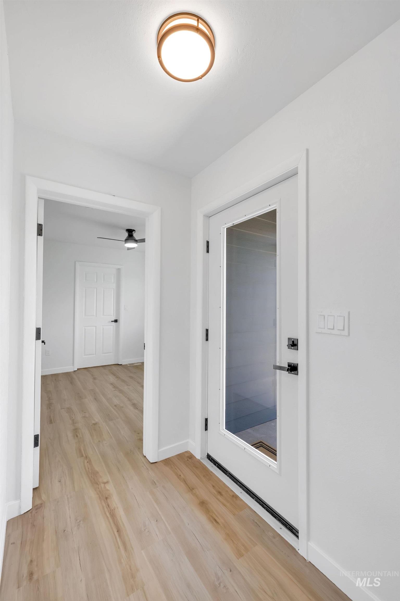 1070 West Indian Valley Road Indian Valley, ID 83632 - Photo 5 of 50 Corridor featuring light wood-type flooring and baseboards