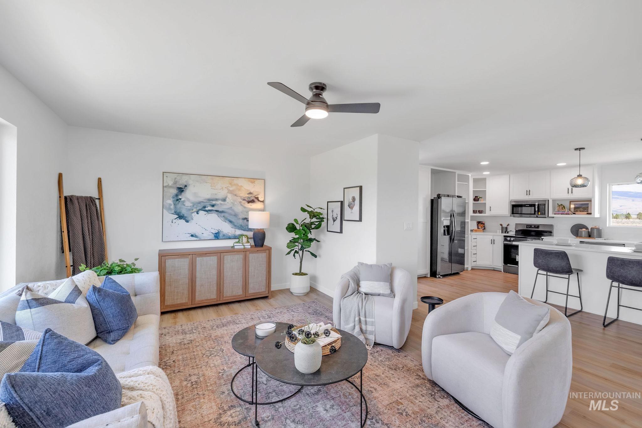 1070 West Indian Valley Road Indian Valley, ID 83632 - Photo 6 of 50 Living area featuring light wood finished floors, a ceiling fan, and recessed lighting