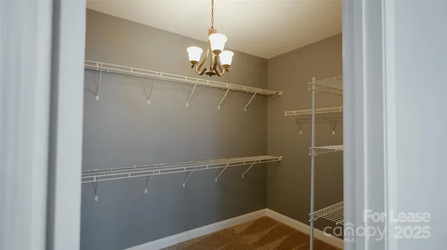 a view of a livingroom with a ceiling fan and window