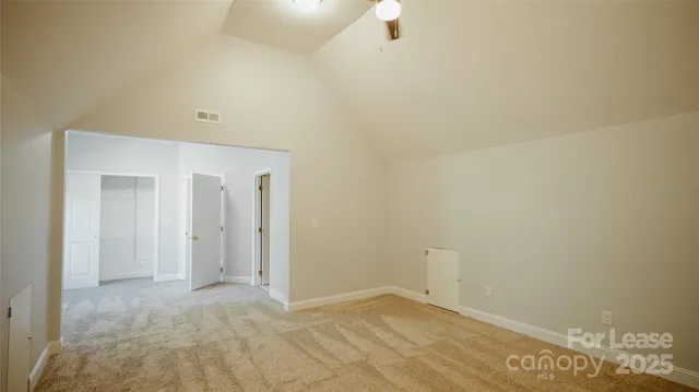 a spacious bathroom with a shower and a sink