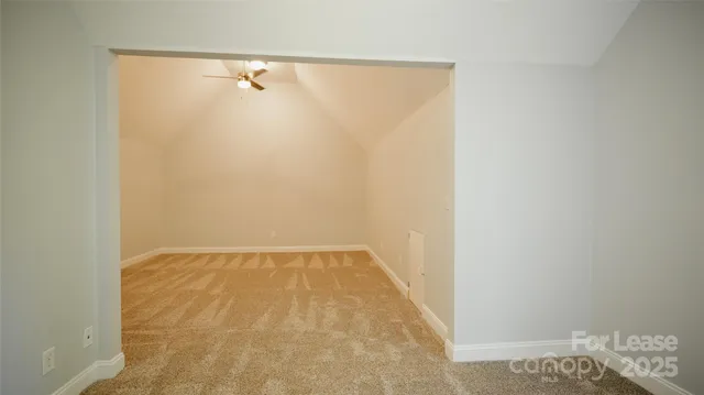 a kitchen with a stove a sink and a microwave