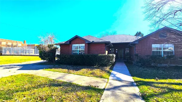 a view of swimming pool in front of house