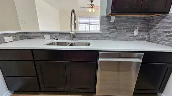 a en suite bathroom with a sink and a mirror