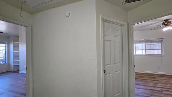 a view of room with wooden floor