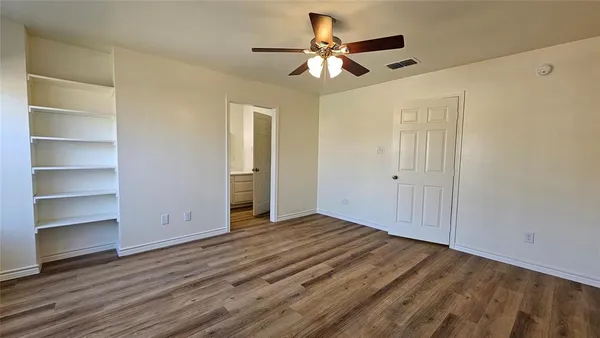 a bathroom with cabinets and sink