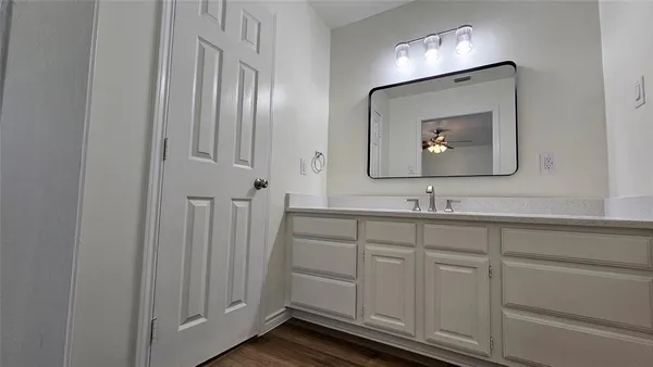 a bathroom with a sink double vanity and a mirror