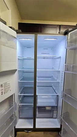 a stove top oven sitting inside of a kitchen