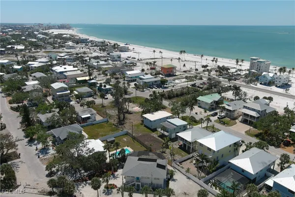 an aerial view of a house with a ocean view