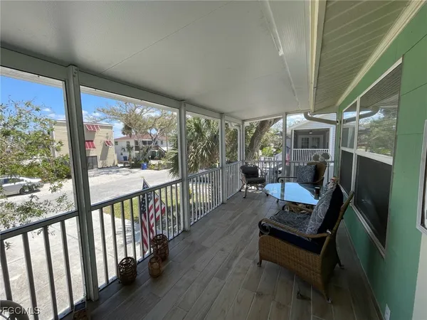 a view of a two chairs in the balcony