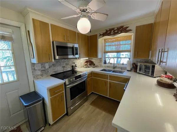 a kitchen with a stove and a microwave