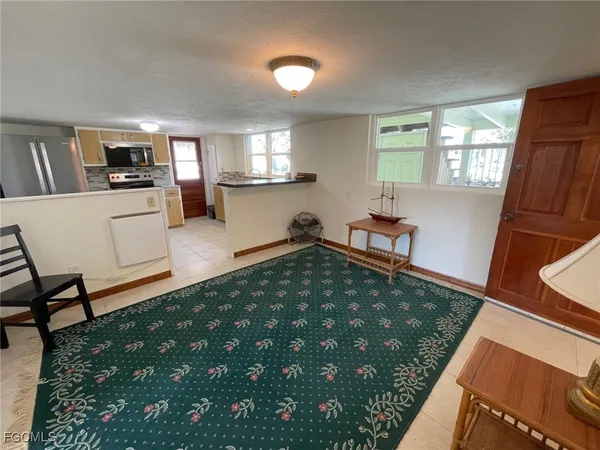 a living room with window and a table