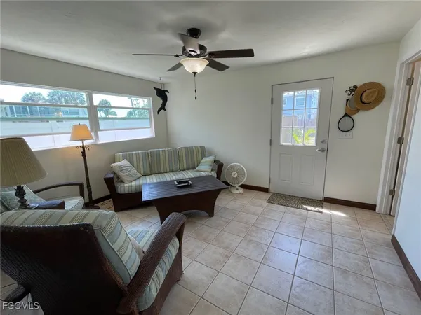 a living room with furniture and a window